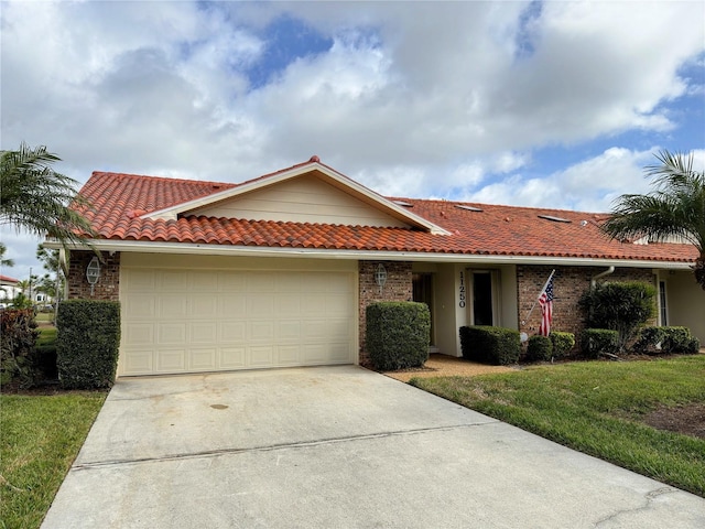 single story home with a front yard and a garage