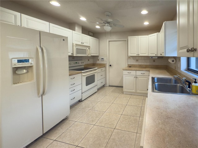 kitchen featuring light tile patterned floors, ceiling fan, white appliances, white cabinets, and sink