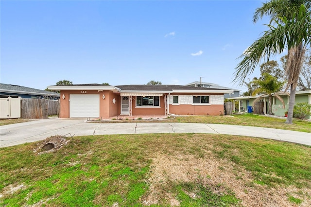 single story home with a front lawn and a garage