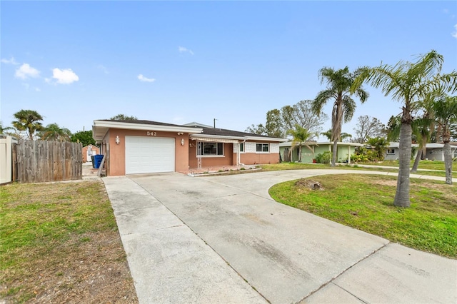 single story home with a front lawn and a garage