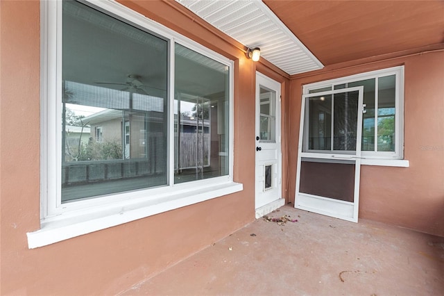 entrance to property featuring a patio area