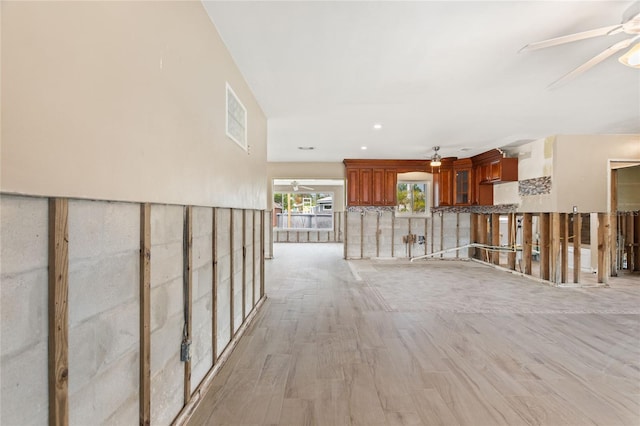 hallway with light wood-type flooring