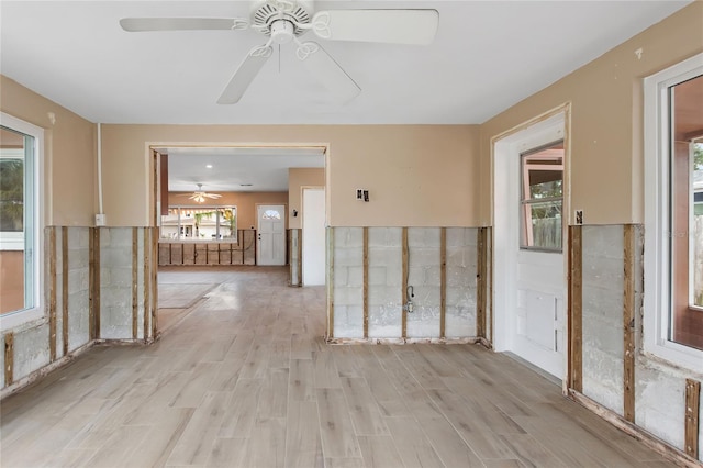 unfurnished room with ceiling fan and light hardwood / wood-style flooring