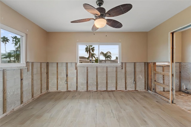 spare room featuring light wood-type flooring and ceiling fan