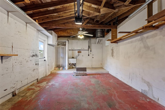 basement with sink and ceiling fan