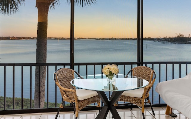 balcony at dusk with a water view