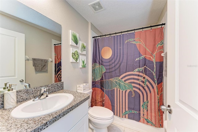 bathroom featuring a textured ceiling, toilet, vanity, and a shower with shower curtain