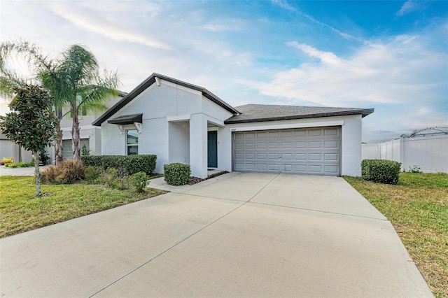 view of front of house with a front yard and a garage