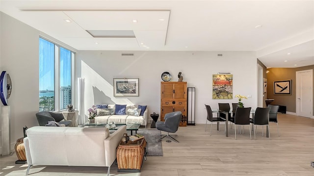 living room with light hardwood / wood-style flooring