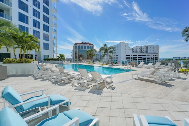 view of swimming pool featuring a patio area