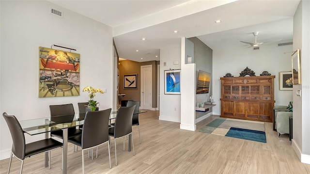 dining space featuring light wood-type flooring and ceiling fan