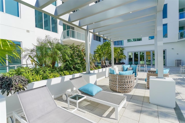 view of patio featuring a pergola and an outdoor living space