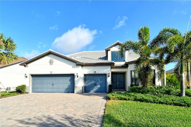 view of front of home with a garage