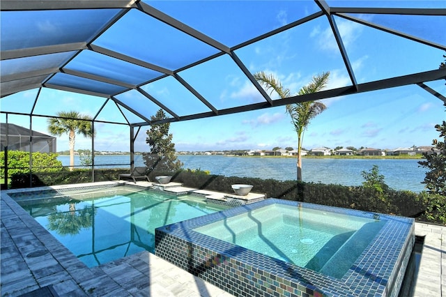 view of swimming pool with an in ground hot tub, a water view, and glass enclosure