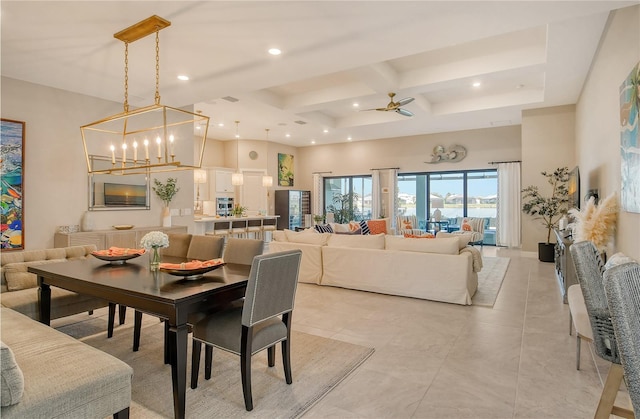 dining area featuring light tile patterned floors, a towering ceiling, beam ceiling, coffered ceiling, and ceiling fan with notable chandelier