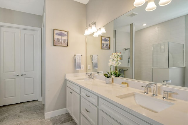 bathroom with vanity and a shower