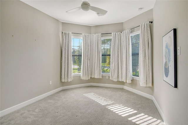 carpeted empty room with ceiling fan