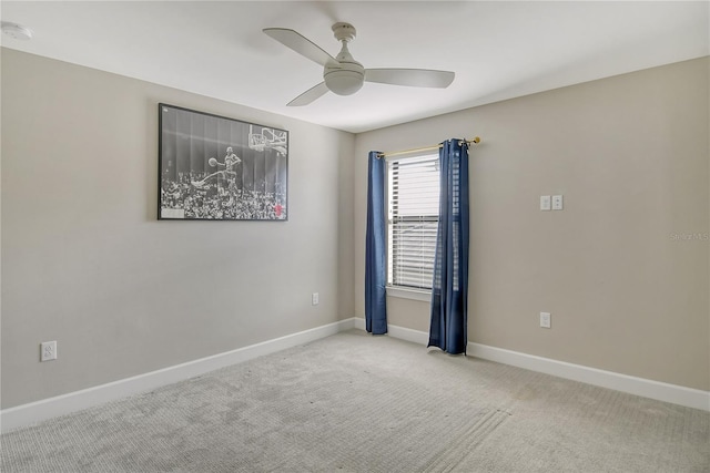 empty room featuring light carpet and ceiling fan