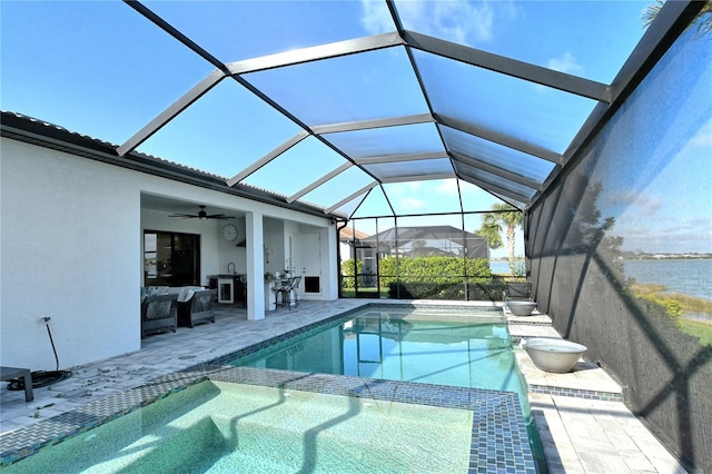 view of pool featuring a water view, ceiling fan, a lanai, and a patio area