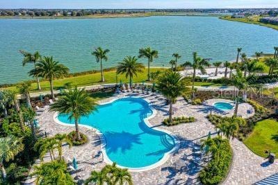 view of swimming pool with a water view