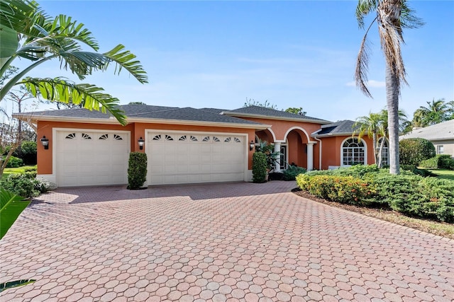 ranch-style home with a garage