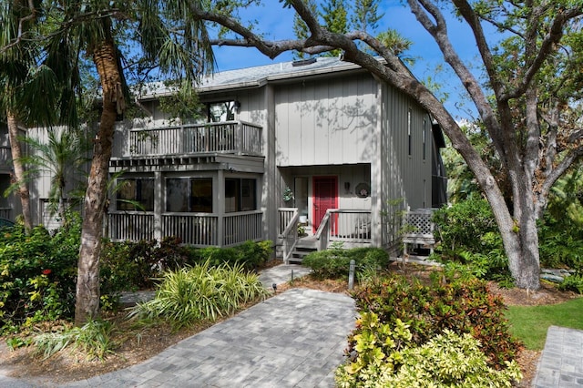 view of front of home featuring a balcony