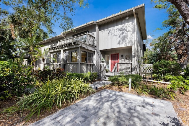 view of front of house with a balcony