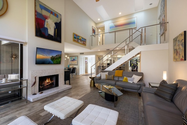 living room featuring hardwood / wood-style floors and a high ceiling