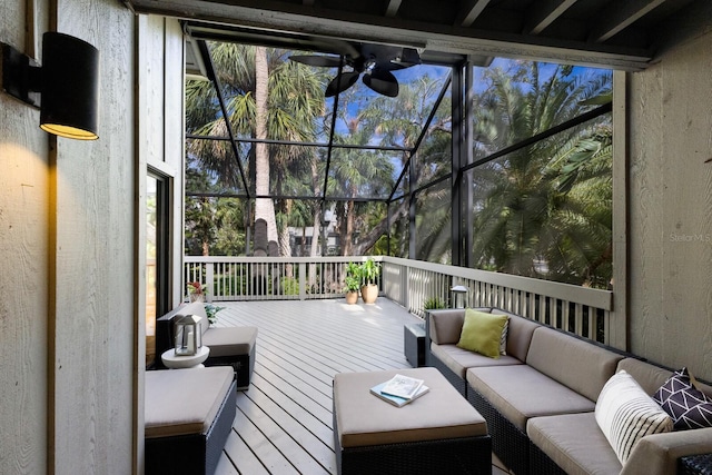 sunroom / solarium featuring ceiling fan