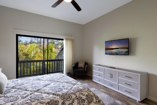 bedroom featuring ceiling fan, access to exterior, and dark hardwood / wood-style flooring