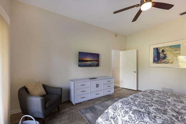 bedroom with ceiling fan and dark wood-type flooring