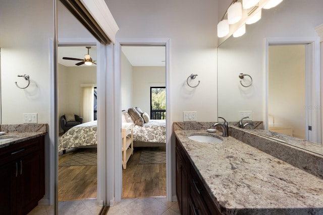 bathroom with ceiling fan, tile patterned flooring, and vanity