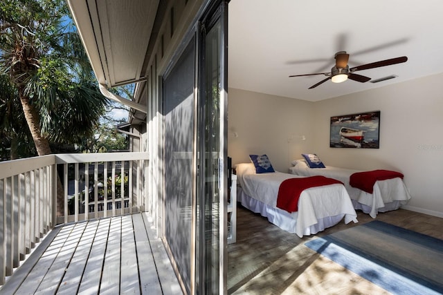 bedroom featuring ceiling fan, hardwood / wood-style floors, and access to outside