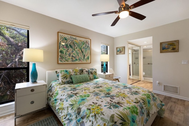 bedroom with ceiling fan, a closet, connected bathroom, and hardwood / wood-style floors