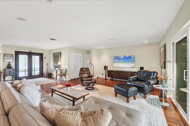 living room with french doors and wood-type flooring