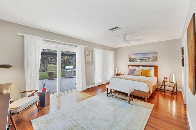 bedroom featuring light wood-type flooring, ceiling fan, and access to exterior