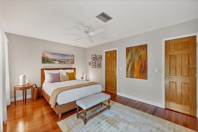 bedroom featuring ceiling fan and hardwood / wood-style flooring