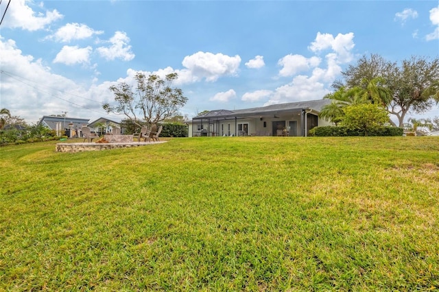 view of yard with a lanai