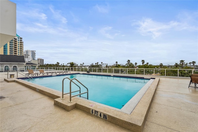 view of swimming pool featuring a patio