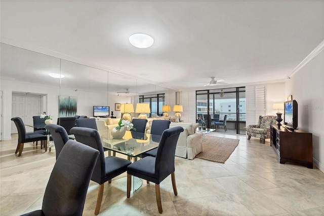 dining space with ceiling fan, expansive windows, and crown molding