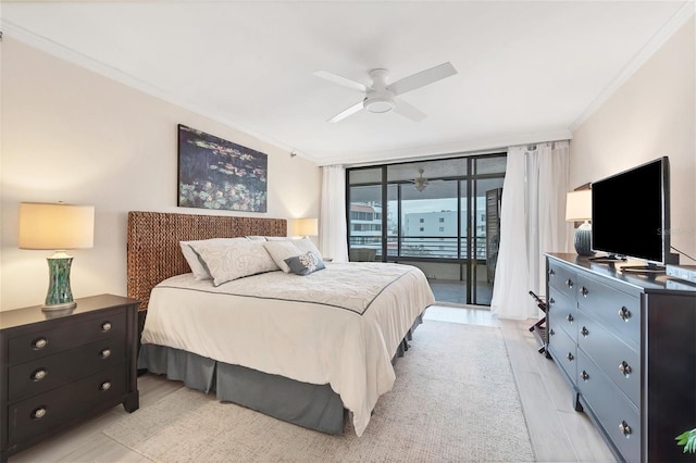 bedroom with ceiling fan, access to exterior, crown molding, light hardwood / wood-style flooring, and expansive windows