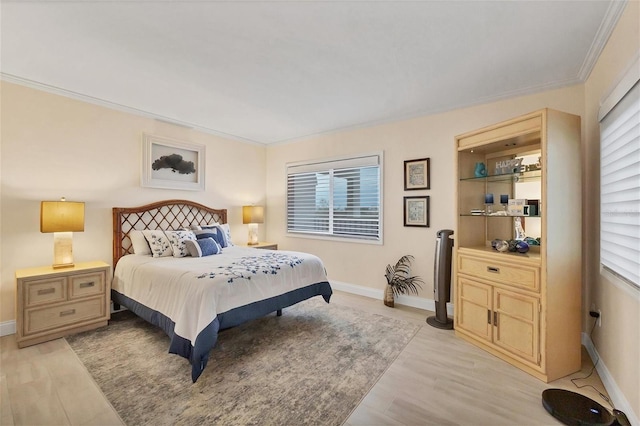 bedroom with light wood-type flooring and ornamental molding