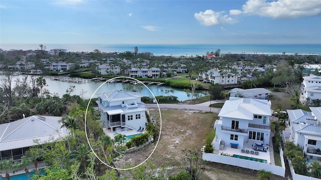 birds eye view of property featuring a water view