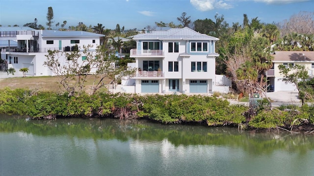 exterior space featuring a water view and a balcony