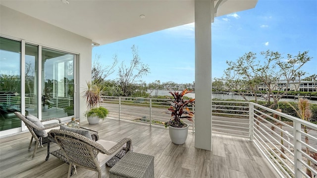 balcony featuring a water view