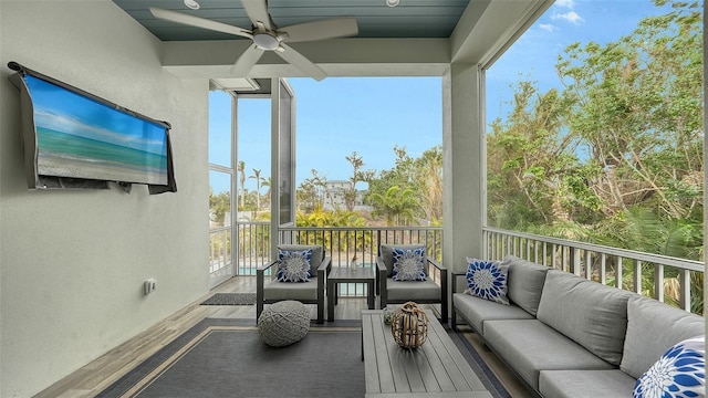 sunroom / solarium with ceiling fan