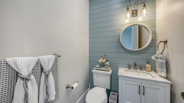 bathroom with toilet and vanity