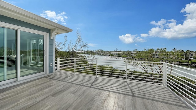 wooden terrace with a water view