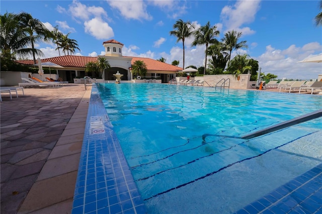 view of swimming pool with a patio area