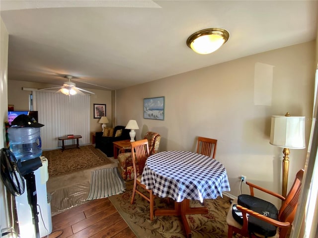 dining space featuring ceiling fan and hardwood / wood-style floors